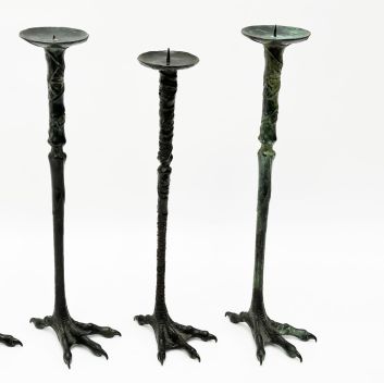 Bahman DADKHAH (b. 1941) Set of four patinated bronze skewers featuring a stilt-walker's leg.
