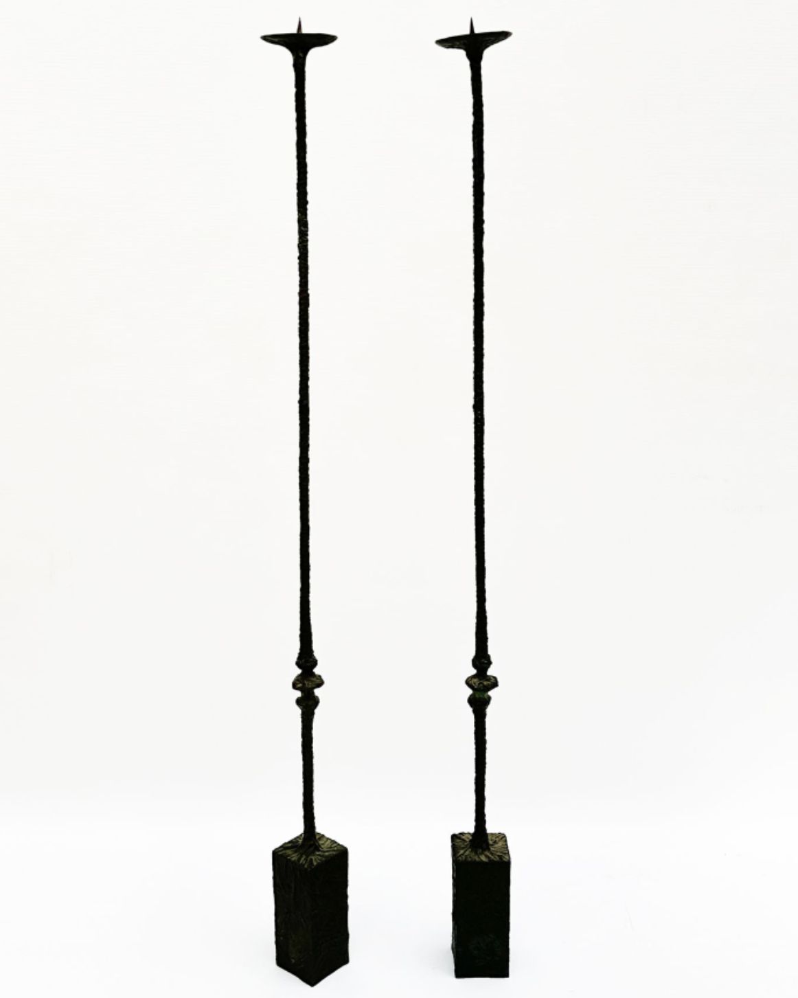 Bahman Dadkhah, pair of patinated bronze candlesticks