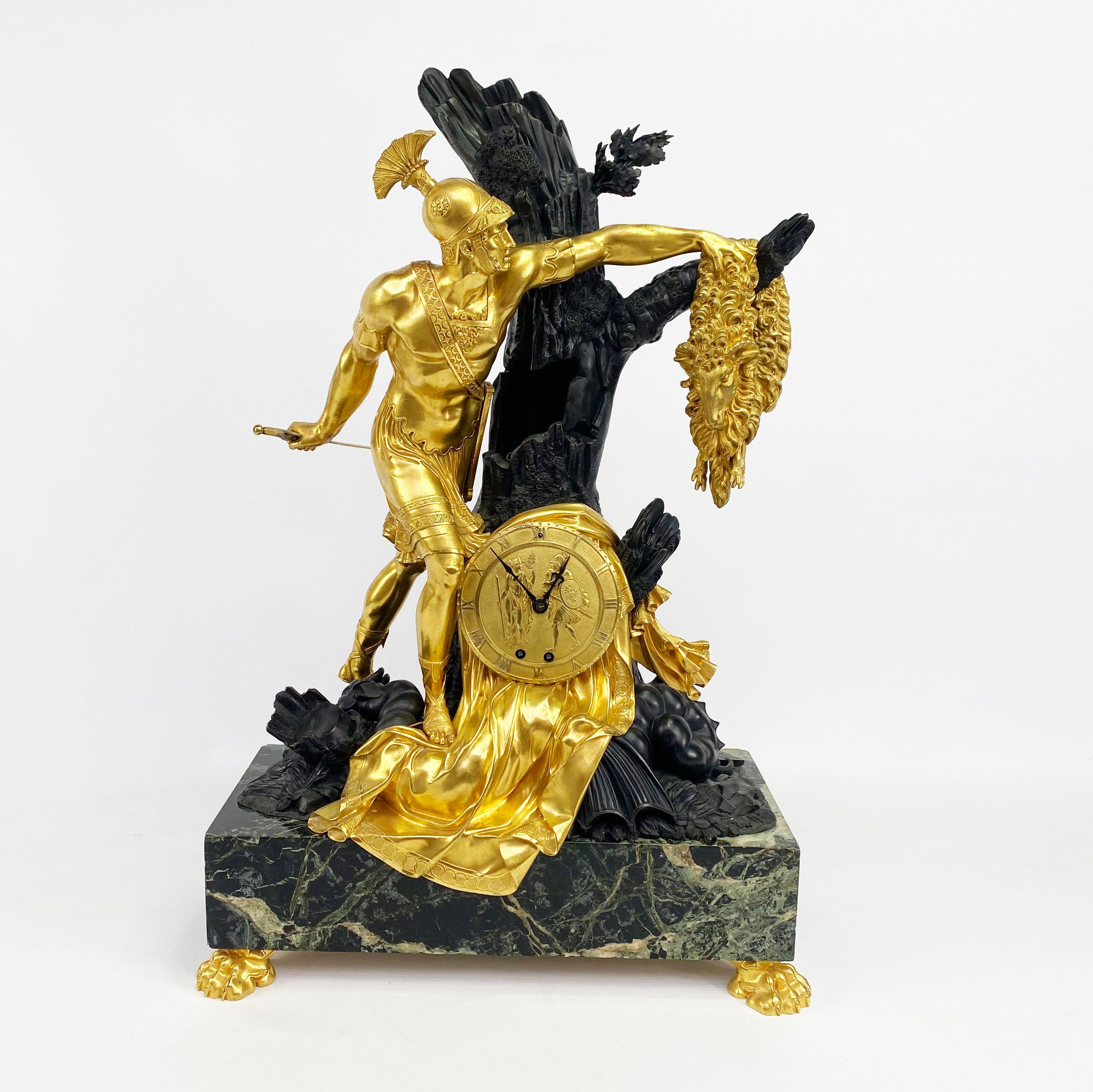 Chased bronze, gold and black marble clock