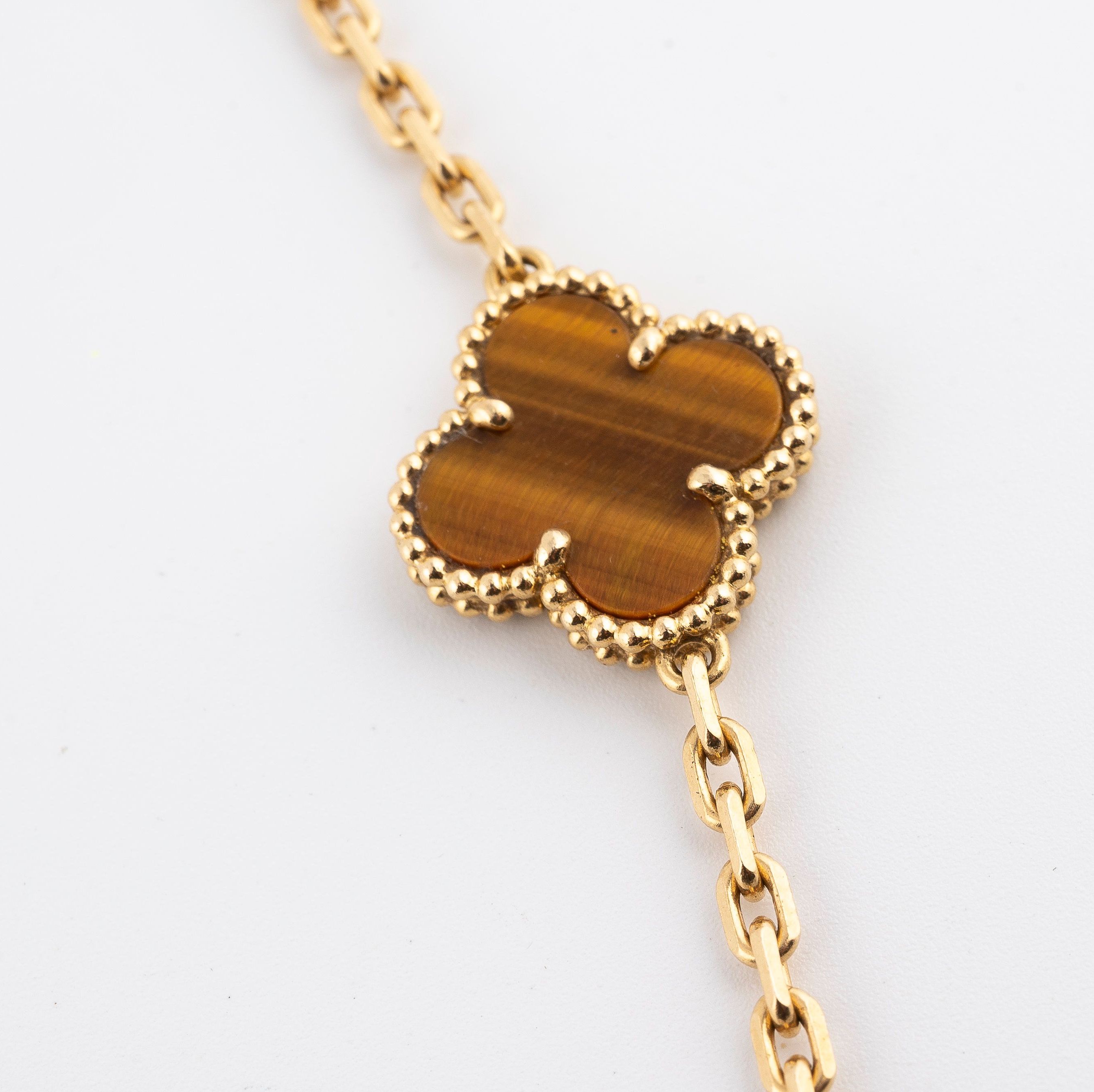 Van Cleef & Arpels, Alhabama long necklace in yellow gold and tiger's eye