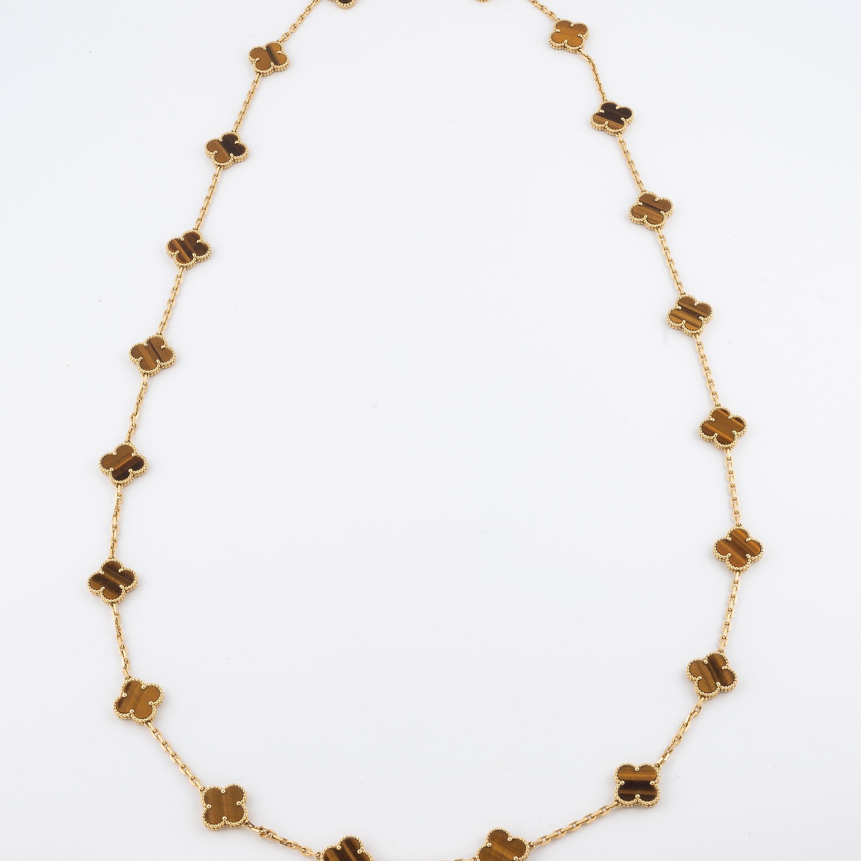 Van Cleef & Arpels, Alhabama long necklace in yellow gold and tiger's eye