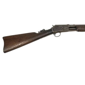 Colt 1887 rifle. Pump system and tubular magazine under the barrel.