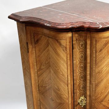 Work of the 18th century, Louis XV period Wood and veneer curved corner cabinet