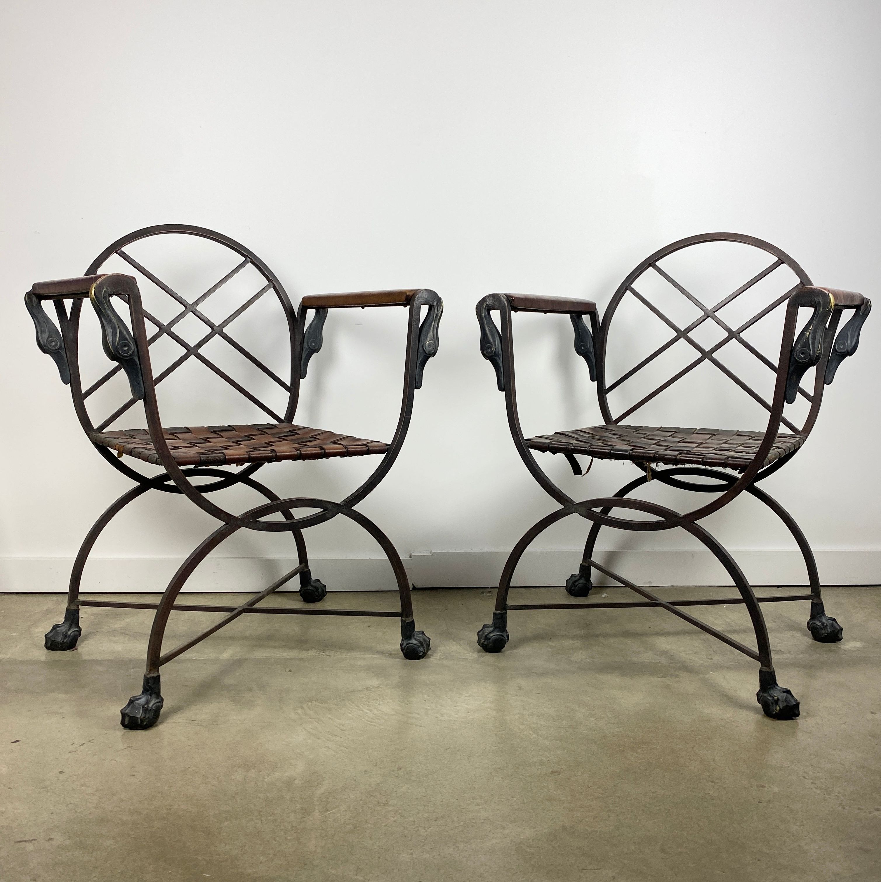 Marcel Coard, pair of wrought iron and leather armchairs